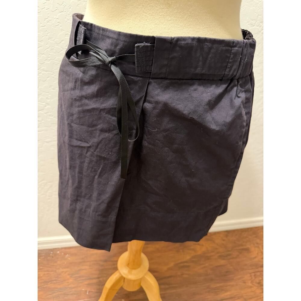 Black mini skirt with pockets and tie